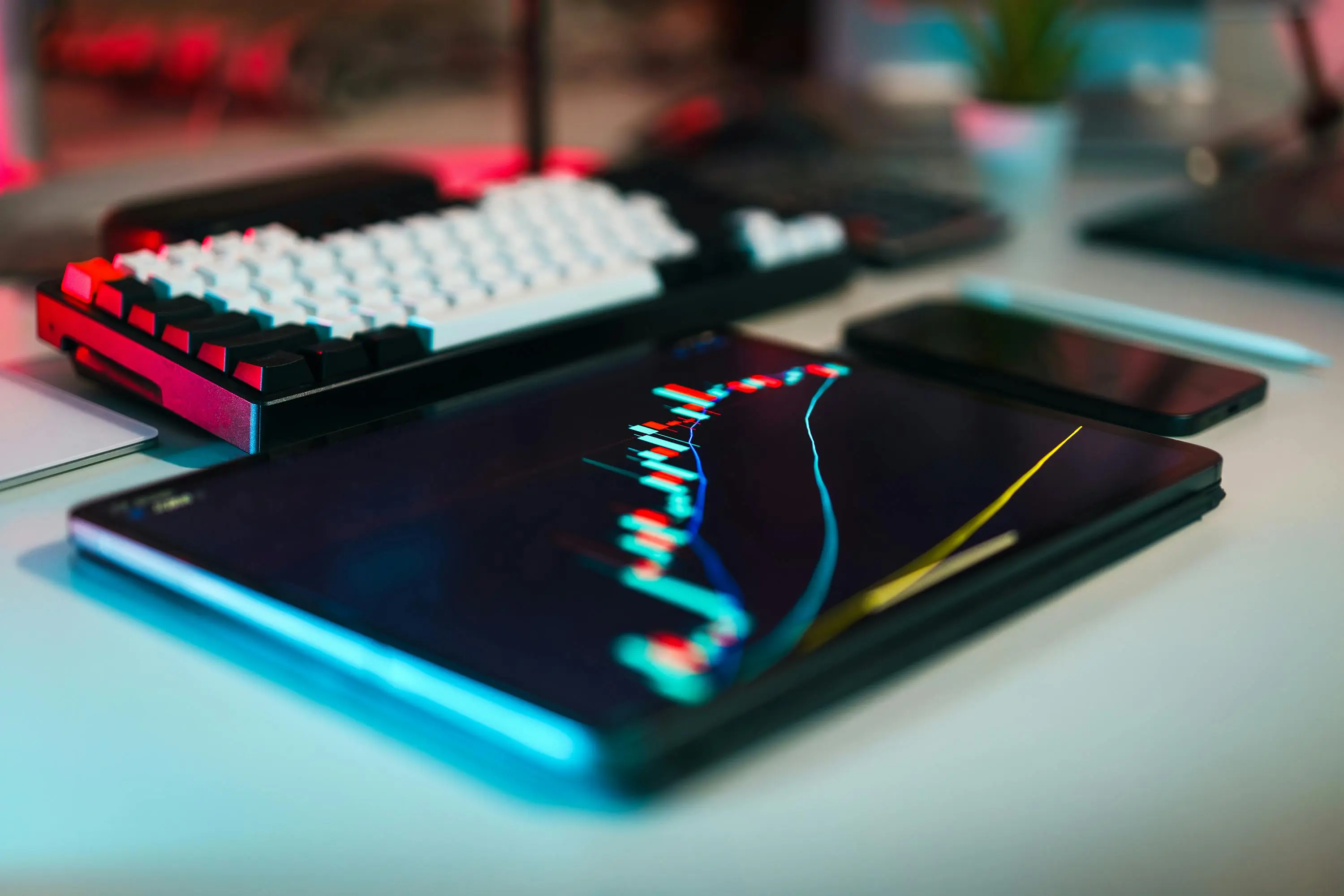 A tablet with a bar graph trending upwards.